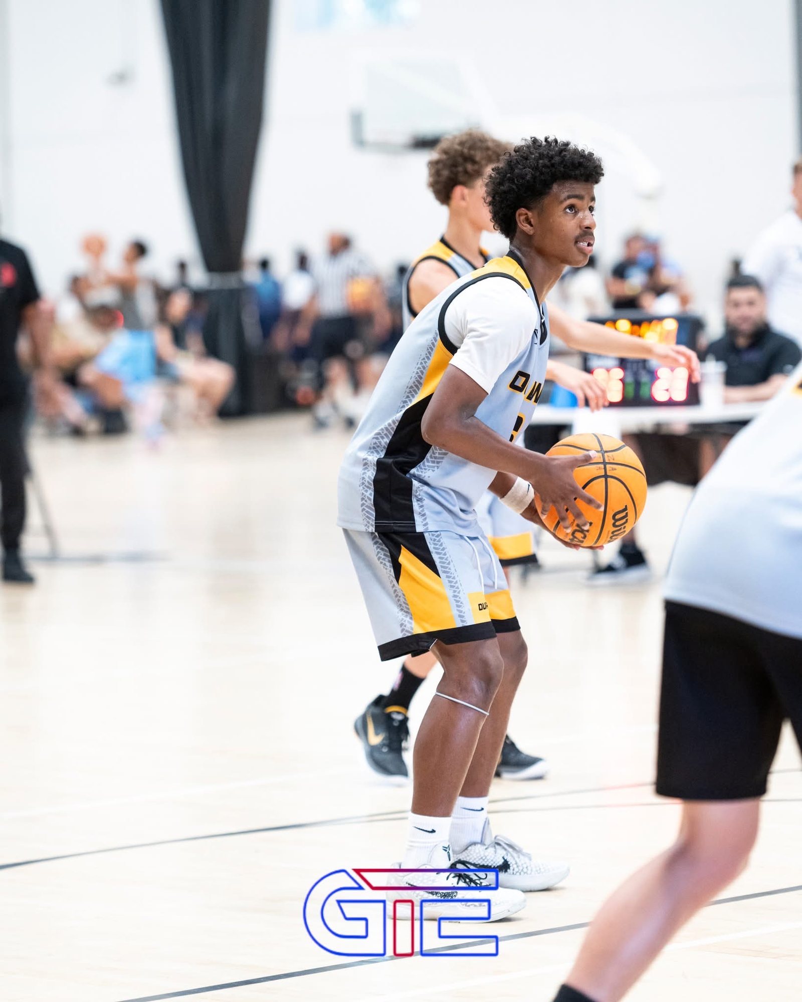 OW player holding the ball in triple-threat position