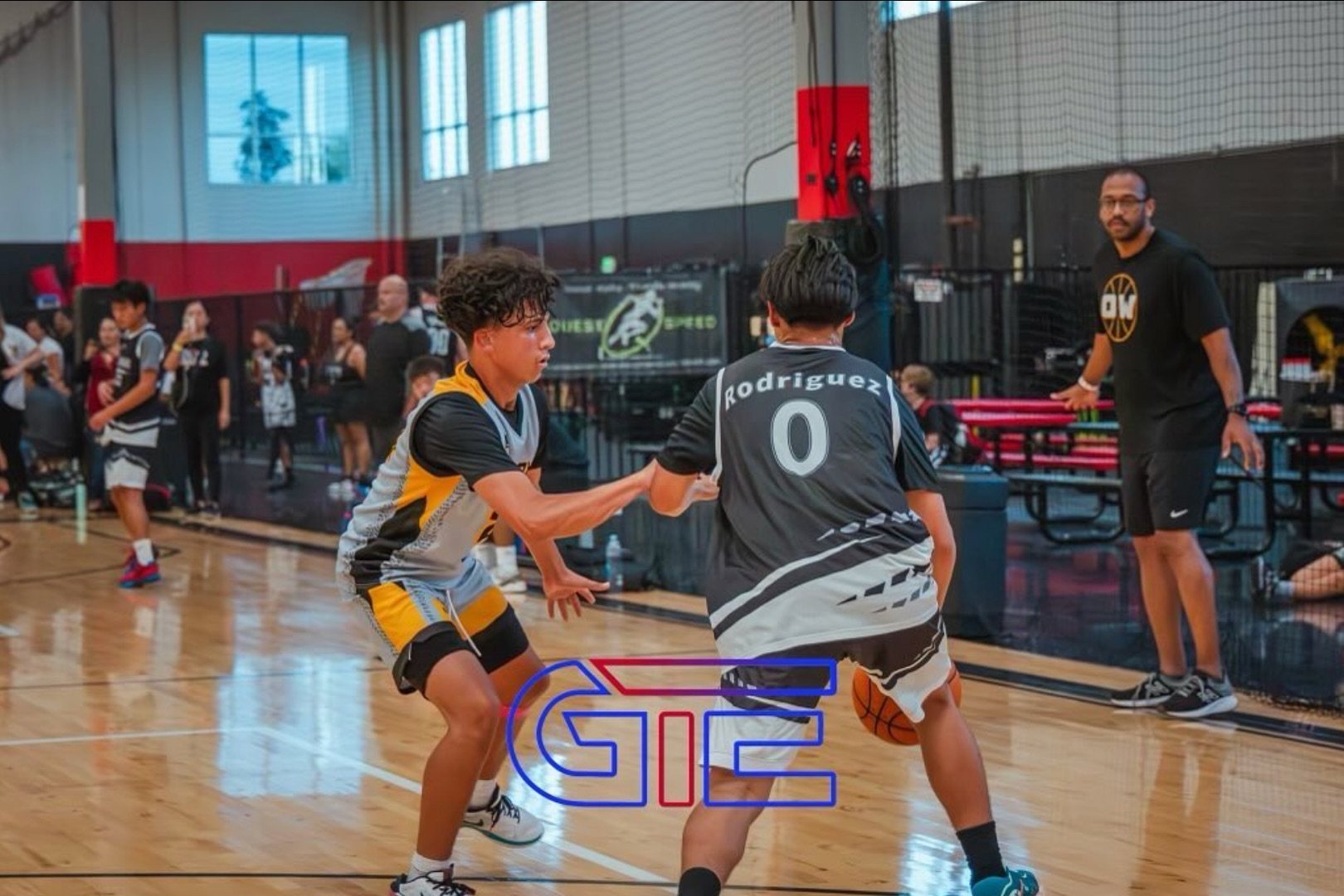 OW player in a defensive stance guarding an opposing ball-handler