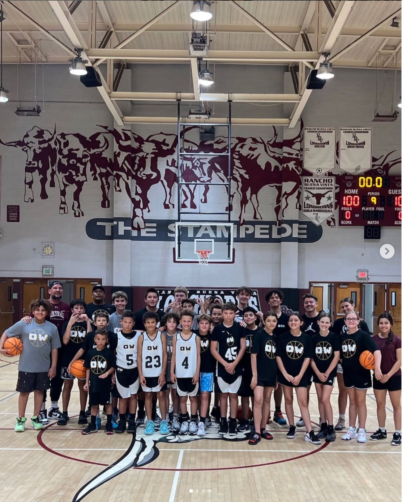OW players and coaches gathered at centre court in the Rancho Buena Vista High School gym